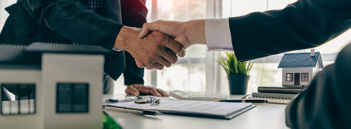 shaking hands after a house purchase