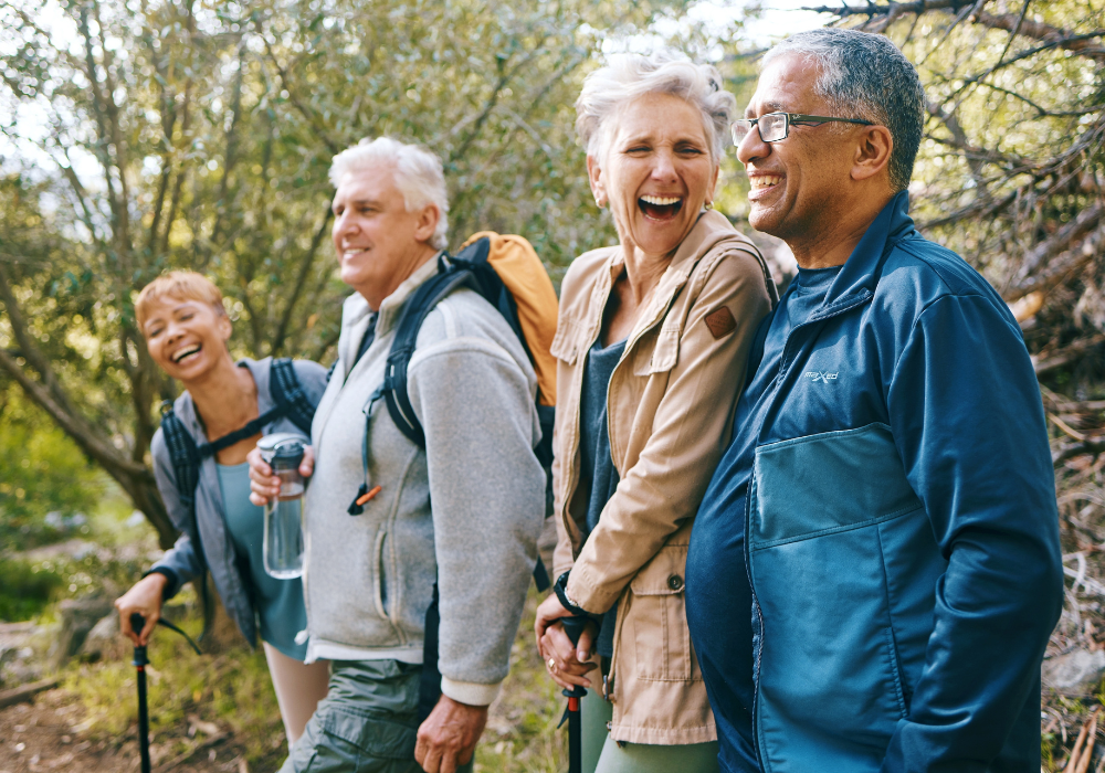 retirees walking through the bush laughing